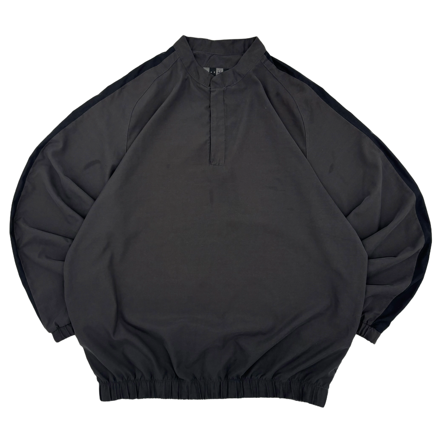 Black vintage Nike Golf windbreaker with a quarter zip on a white background
