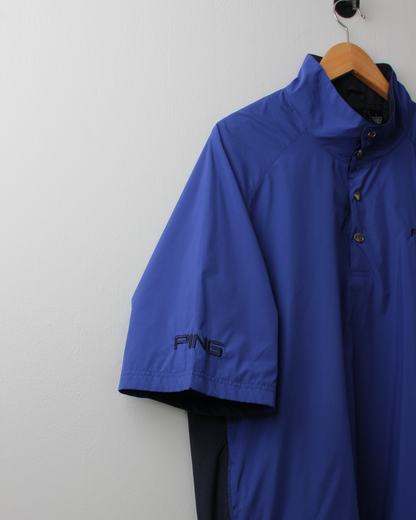 90s Ping ‘Mr Ping’ Logo Blue Short Sleeve Windbreaker (L)