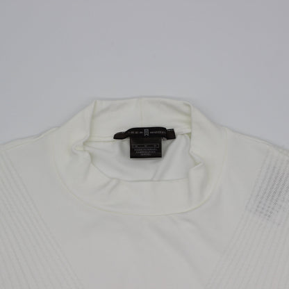 White Tiger Woods Mock Neck with a tag on a light gray background